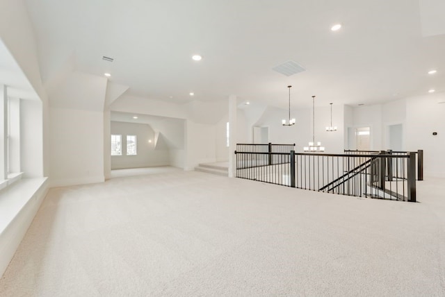 1813 Cousins Trl, Frisco, TX 75034 - unfurnished living room with a chandelier, light carpet, recessed lighting, and lofted ceiling