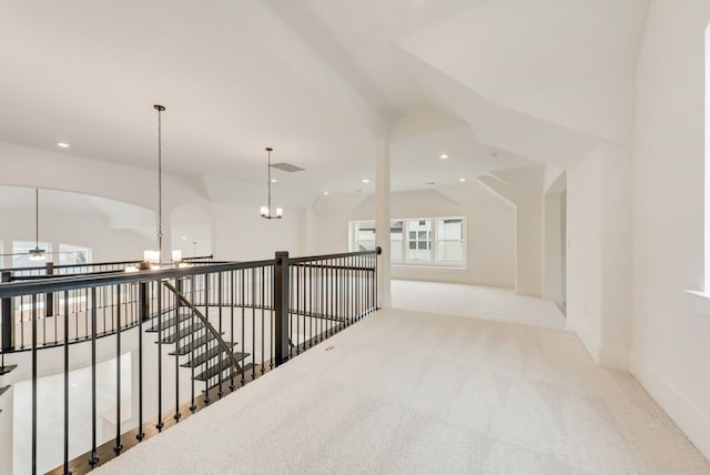 hallway with visible vents, baseboards, an inviting chandelier, carpet, and recessed lighting