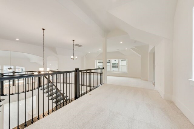 1813 Cousins Trl, Frisco, TX 75034 - corridor with a chandelier, carpet flooring, an upstairs landing, lofted ceiling, and baseboards