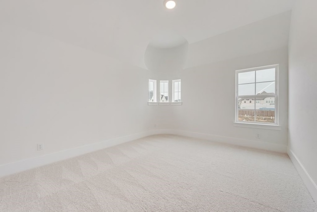 unfurnished room featuring recessed lighting, baseboards, and light colored carpet