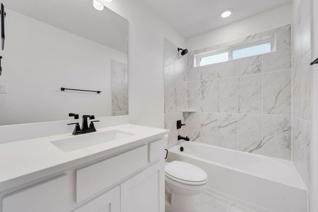 bathroom with marble finish floor, tub / shower combination, vanity, and toilet