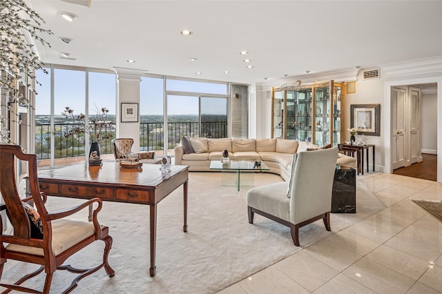 living room with light tile patterned floors, recessed lighting, visible vents, expansive windows, and ornate columns