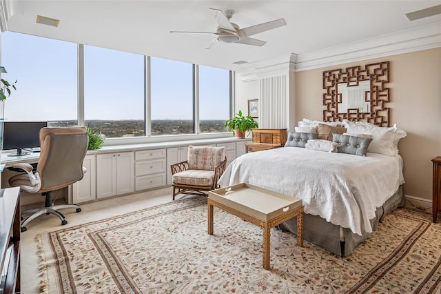 bedroom featuring ornamental molding, visible vents, and a ceiling fan