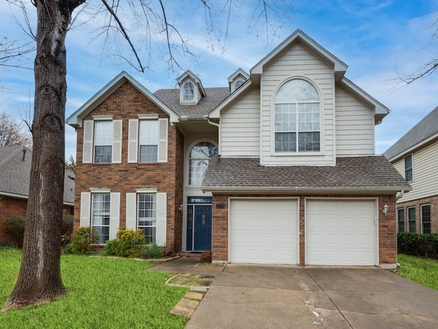 traditional-style home featuring brick siding, driveway, and roof with shingles