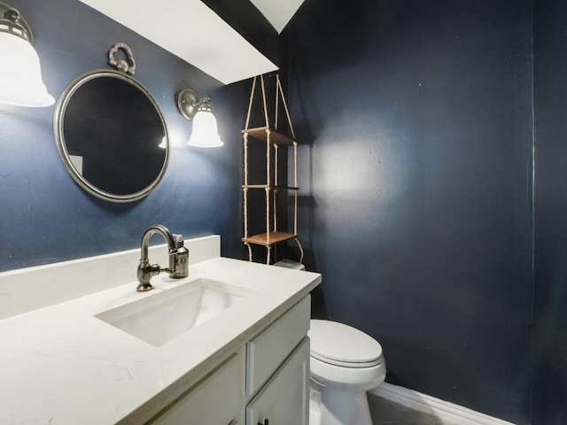 half bath with vanity and toilet