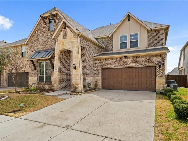 view of front of home with a garage, stone siding, a shingled roof, and brick siding