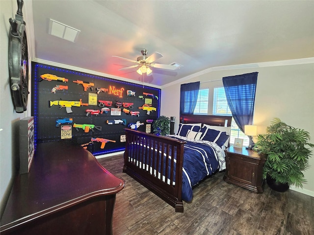 bedroom with wood finished floors, vaulted ceiling, ornamental molding, visible vents, and a ceiling fan