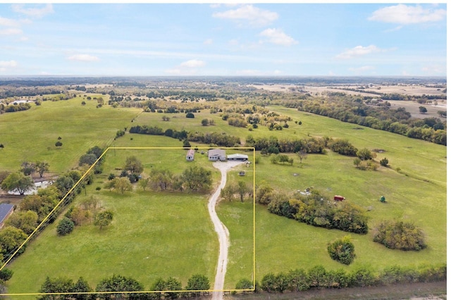 birds eye view of property with a rural view