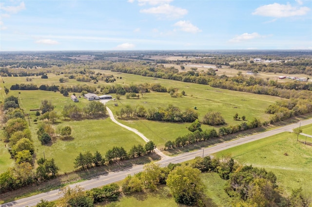 birds eye view of property with a rural view
