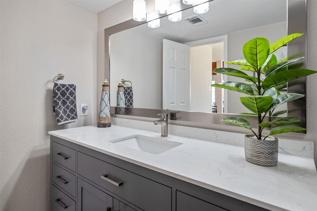 bathroom with visible vents and vanity