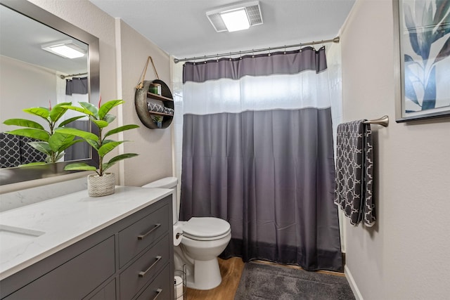 bathroom with vanity, wood finished floors, visible vents, curtained shower, and toilet