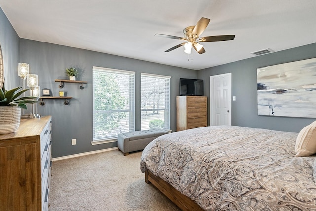 bedroom featuring a ceiling fan, carpet, visible vents, and baseboards