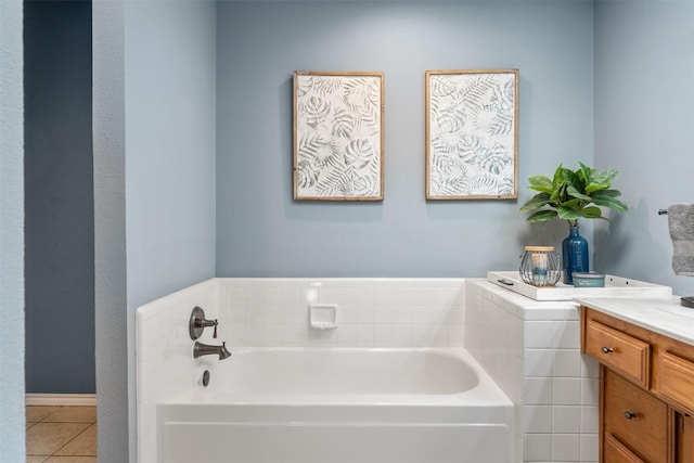 full bathroom with tile patterned floors, a bath, and vanity