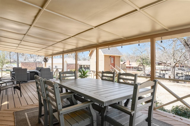 wooden deck featuring outdoor dining space