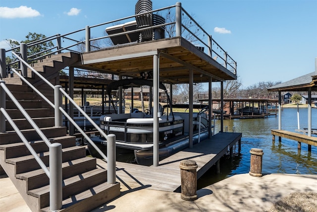 dock area featuring a water view and stairs