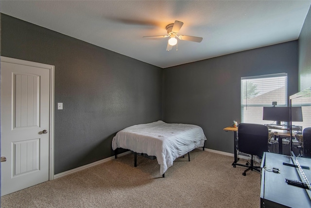 bedroom with carpet floors, baseboards, and a ceiling fan