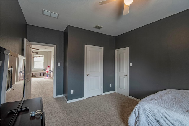 bedroom featuring light colored carpet, visible vents, and baseboards