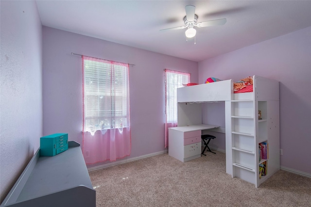 bedroom with ceiling fan and light colored carpet