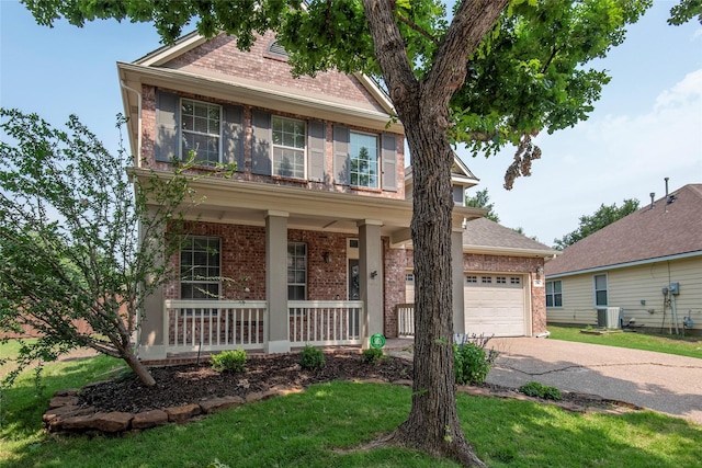 view of front of home with brick siding, covered porch, concrete driveway, an attached garage, and cooling unit