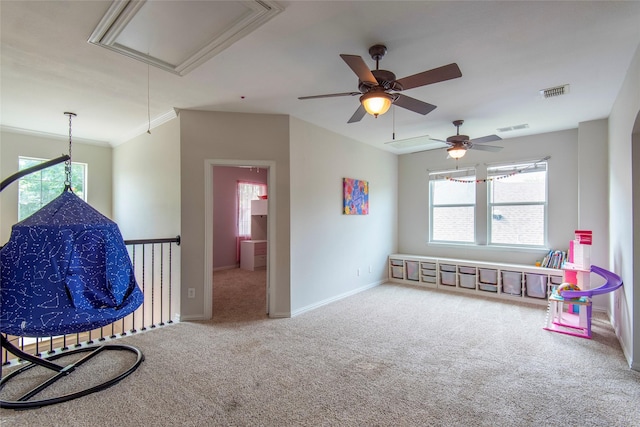 game room featuring visible vents, carpet floors, attic access, and a healthy amount of sunlight