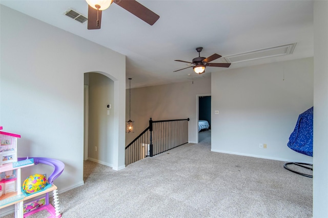 rec room featuring carpet floors, attic access, visible vents, and baseboards