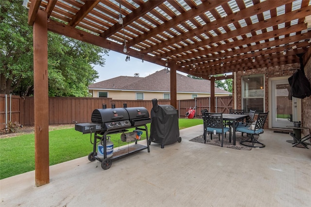 view of patio with outdoor dining area, a fenced backyard, and grilling area