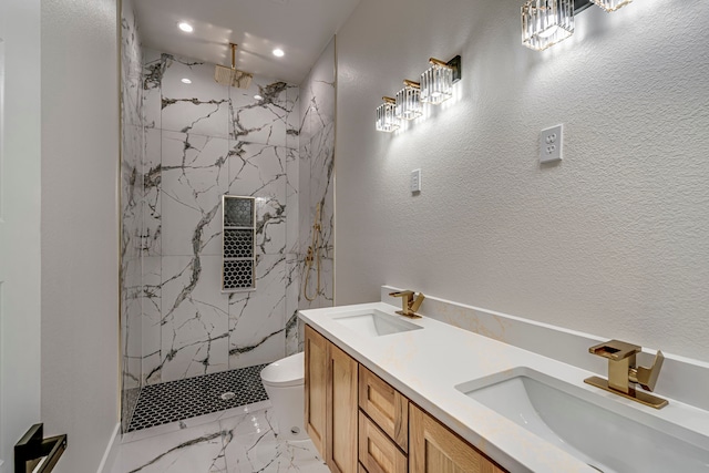 bathroom with marble finish floor, a sink, and a marble finish shower