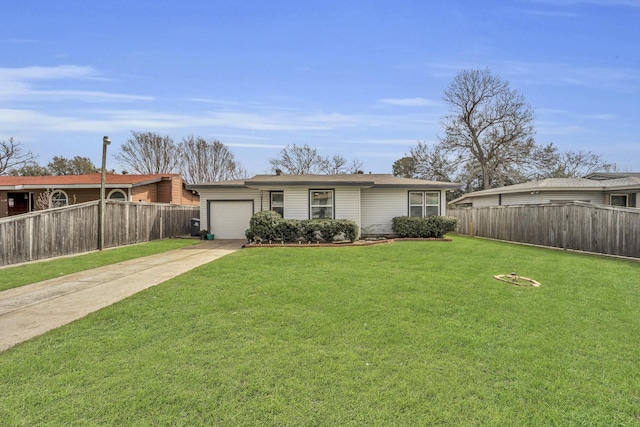 view of front of house featuring a garage, a front yard, driveway, and fence