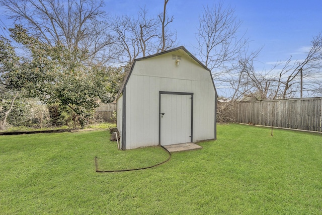 view of shed with a fenced backyard