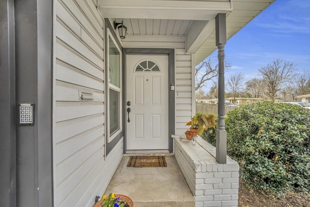 doorway to property featuring covered porch