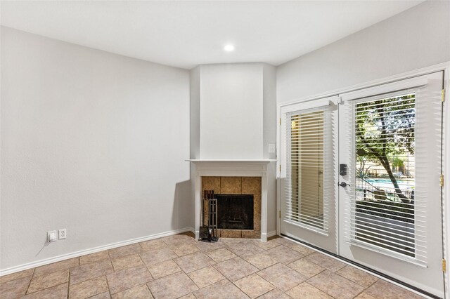 unfurnished living room with a fireplace and baseboards