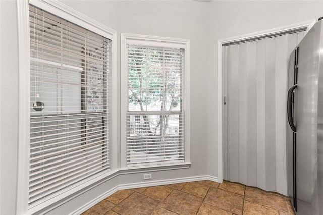 interior space featuring baseboards