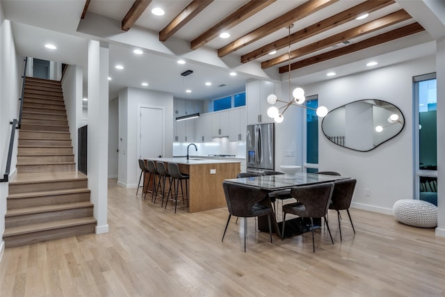 dining room featuring recessed lighting, stairway, light wood-type flooring, beamed ceiling, and baseboards