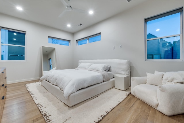 bedroom featuring recessed lighting, visible vents, ceiling fan, wood finished floors, and baseboards