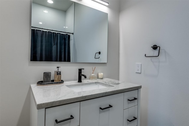 full bathroom with a shower with curtain and vanity