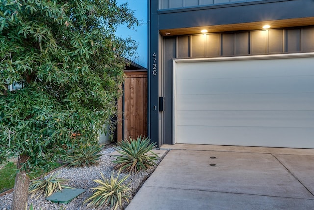 garage with concrete driveway