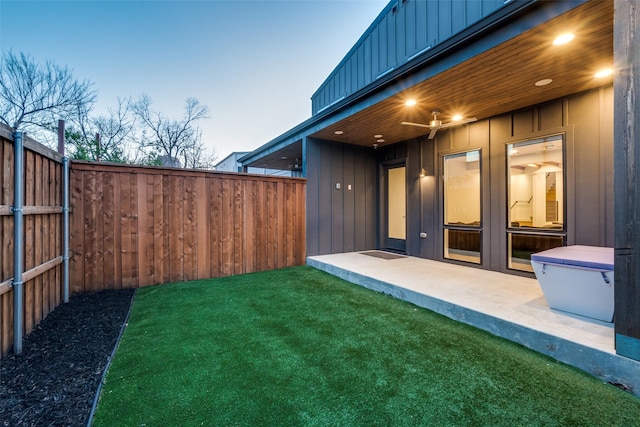 view of yard featuring a patio area and a fenced backyard