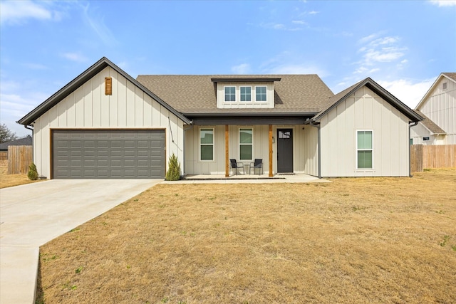 modern farmhouse style home with a garage, a shingled roof, fence, driveway, and board and batten siding