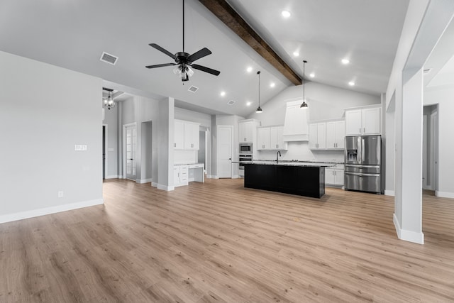 kitchen with stainless steel appliances, open floor plan, visible vents, and beam ceiling