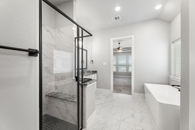 full bath featuring marble finish floor, a freestanding tub, a shower stall, and visible vents