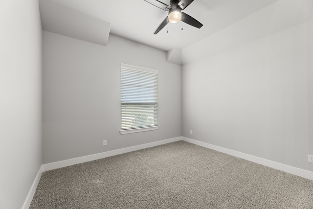 spare room featuring carpet flooring, a ceiling fan, and baseboards