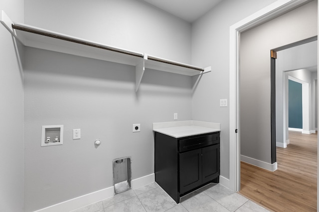 laundry area with laundry area, baseboards, gas dryer hookup, washer hookup, and electric dryer hookup