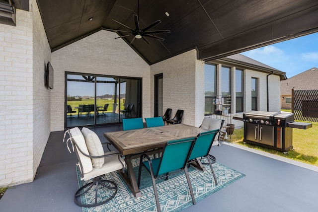 view of patio / terrace featuring ceiling fan, outdoor dining area, and a grill