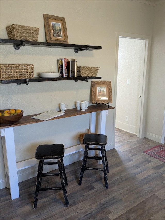 details with baseboards and wood finished floors