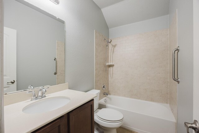 full bathroom with toilet, shower / bathing tub combination, vaulted ceiling, and vanity