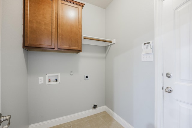 laundry room with washer hookup, cabinet space, gas dryer hookup, electric dryer hookup, and baseboards