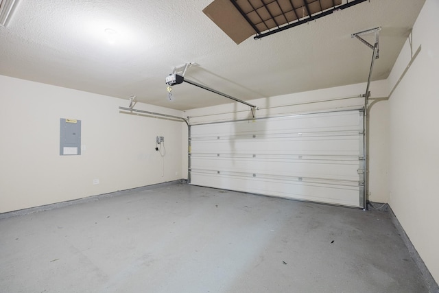 garage featuring electric panel and a garage door opener