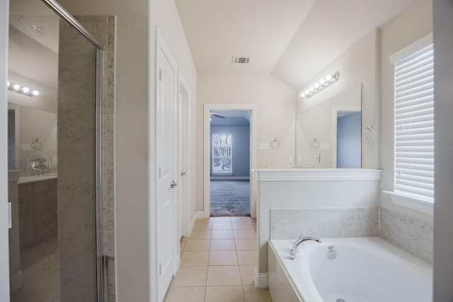 bathroom with a stall shower, tile patterned flooring, visible vents, and a garden tub