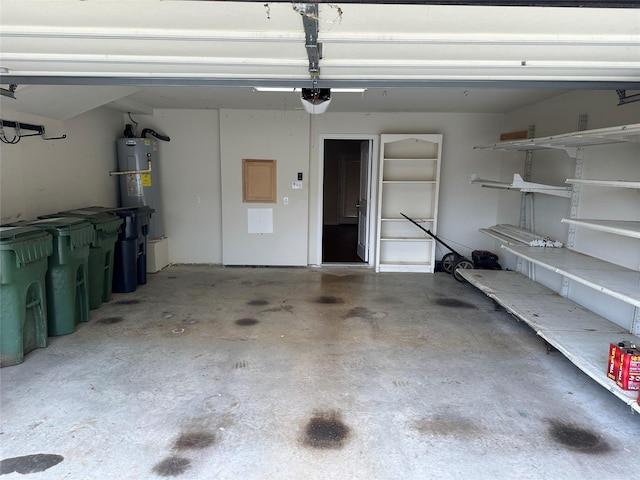 garage with water heater and a garage door opener