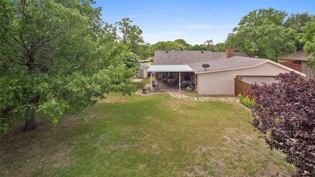 exterior space featuring a garage, a patio, and fence